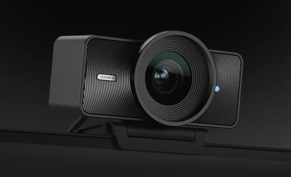 Gif showing various colours of f Facecam 4K mounted on top of a monitor.