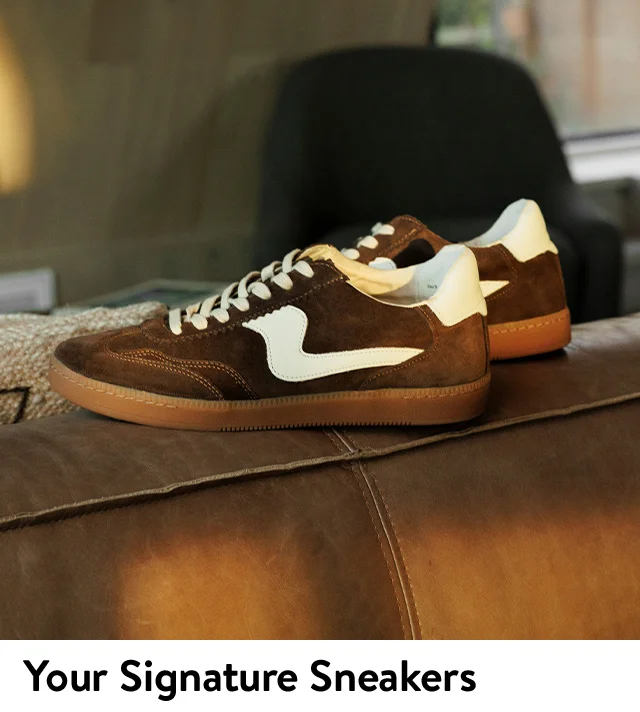 A pair of brown suede sneakers.