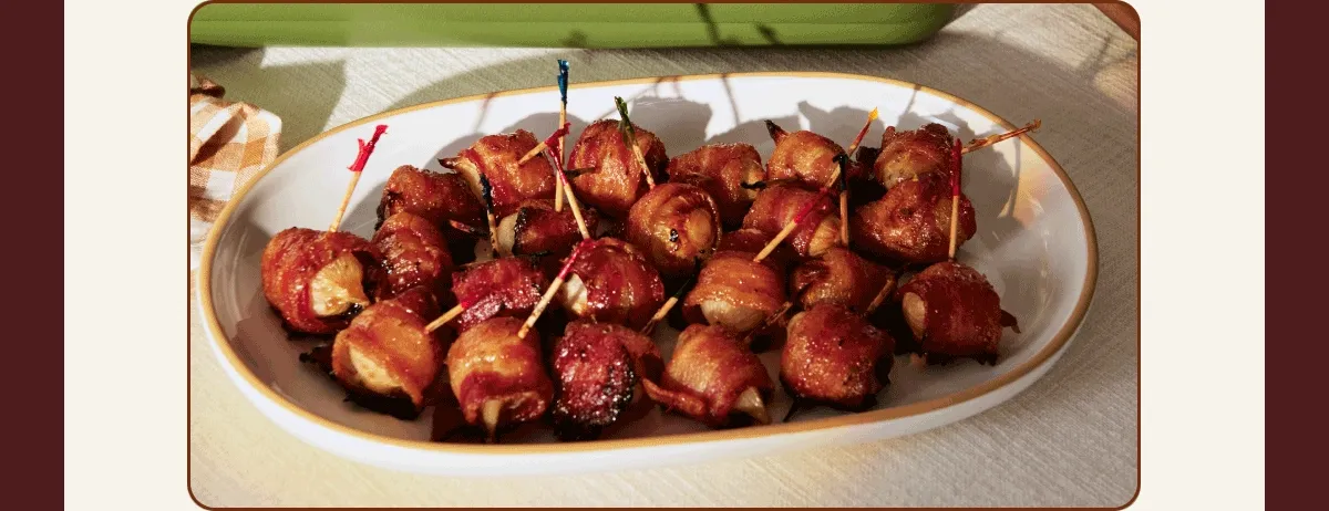 Rosemary-Fennel Glazed Ham with Bacon-Wrapped Pearl Onion Bites  Meet the highlight of your holiday table. This centerpiece-worthy dish leaves you with a bonus appetizer and pan sauce.