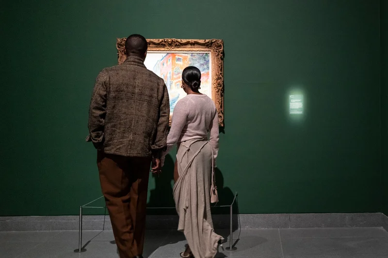 Couple looking at painting together
