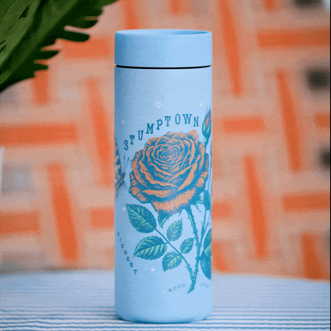 an image of a blue bottle with a rose on it