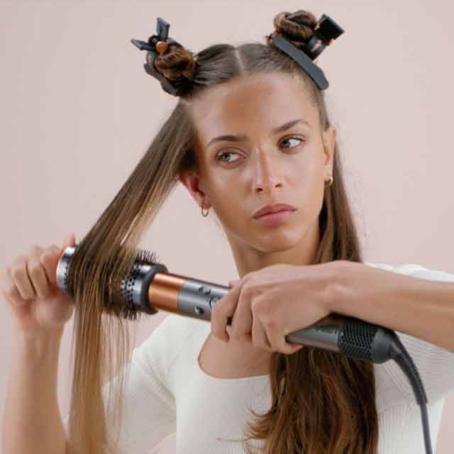 A model using Dyson hair care technology