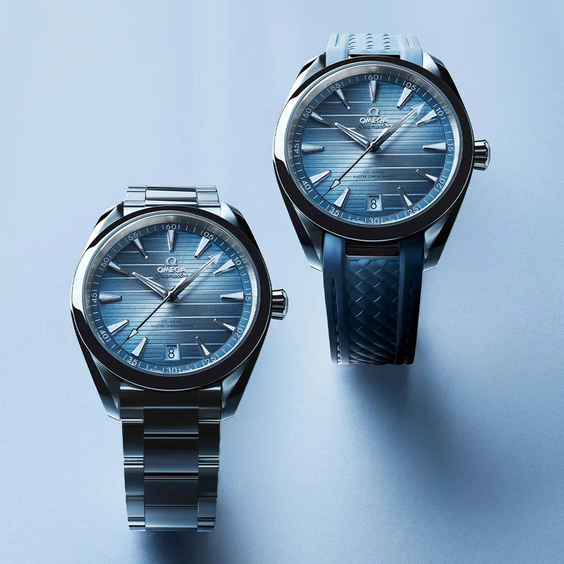 Two Seamaster Aqua Terra watches with Summer blue dials on a light background.