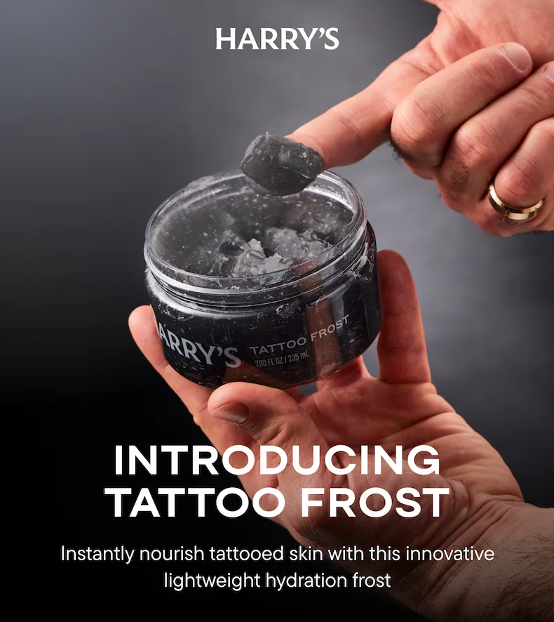 finger scooping black gel from jar