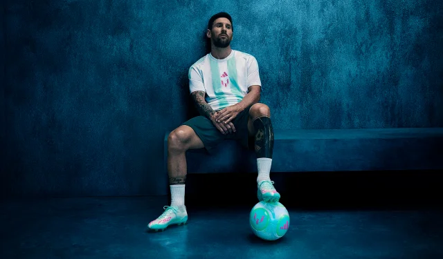 Lionel Messi stands in a blue-lit studio, dressed in his adidas collection and gazing confidently at the camera.