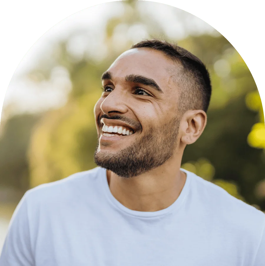 Young smiling athlete in public park