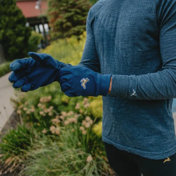 Man wearing Tracksmith gloves and apparel