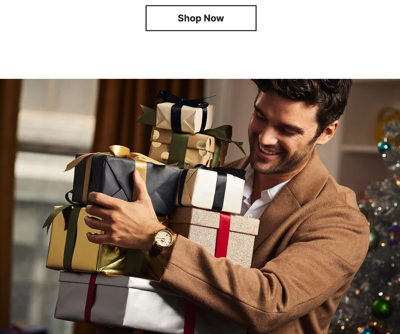 SHOP NOW | Image of person carrying giftboxes