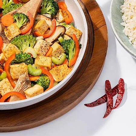 a colorful chinese stir-fry made with tofu and veggies using chinese 5-spice blend