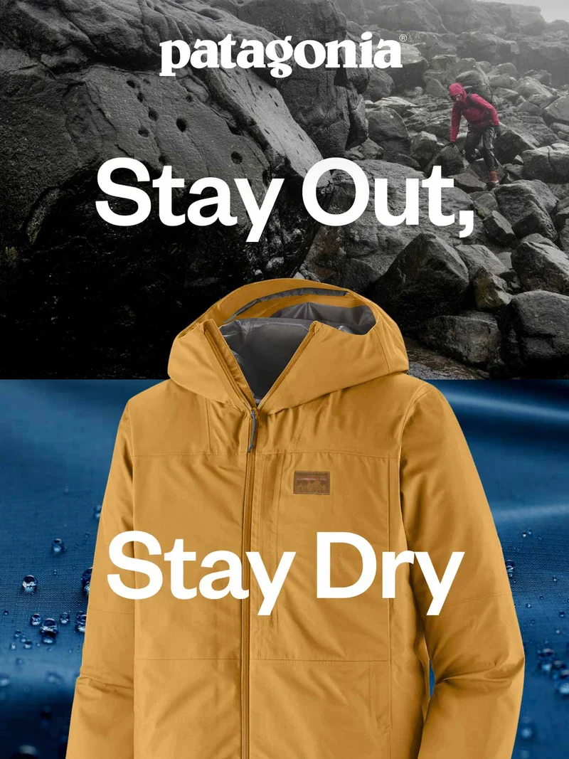 Stay Out, Stay Dry. A hiker navigates a jumble of black boulders in the rain.