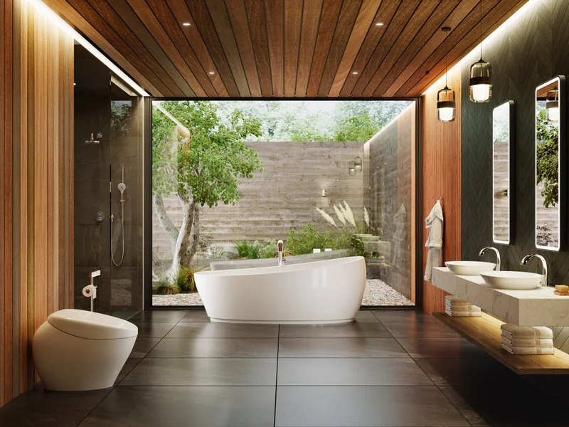 Pieces from TOTO's NEOREST®  collection in a sunlit bathroom with a large window