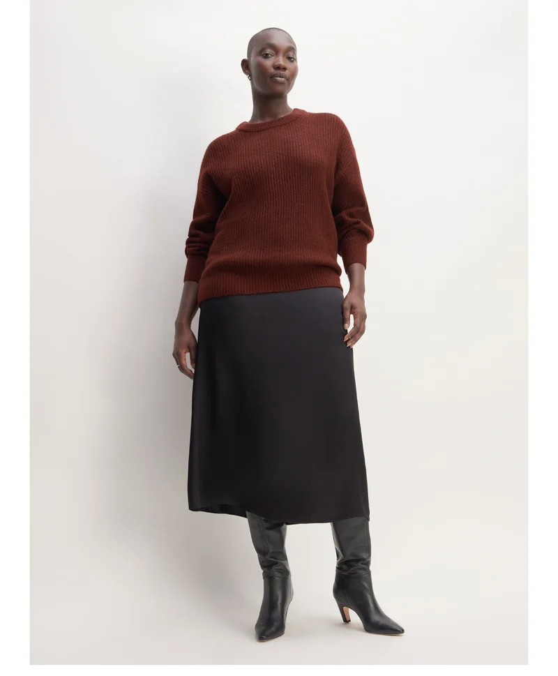 The Alpaca Crew the Hammered Satin Slip Skirt, and the Knee-High Banana Heel Boot