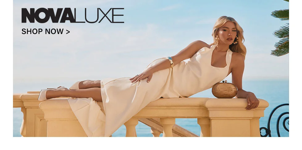 Confident woman modeling a cream strapless bodycon mini dress, reclining on white. Shop the BODYCTRL™ collection now.