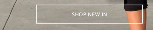Person wearing black shorts with a "SHOP NEW IN" call-to-action button. Explore our new fashion arrivals and latest collection.