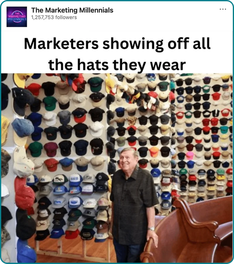 Social post from The Marketing Millenials with the words marketers showing off all the hats they wear, with a picture of man smiling surrounded by hats.