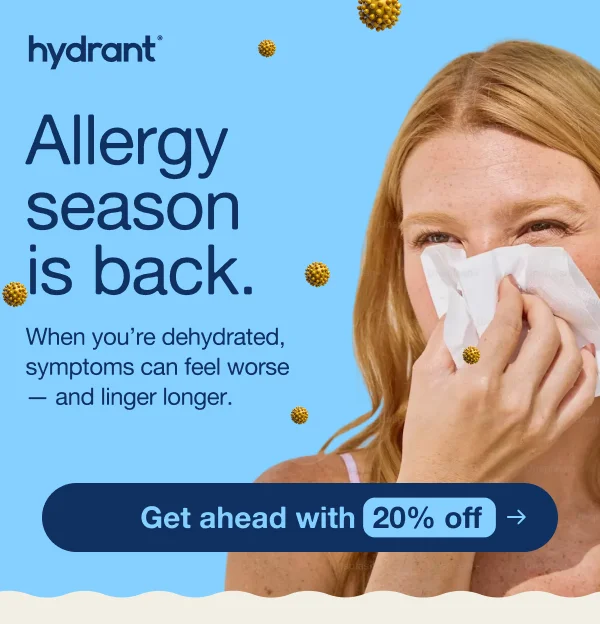 an image of a woman blowing her nose with a tissue