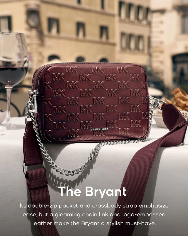 The Bryant Its double-zip pocket and crossbody strap emphasize ease, but a gleaming chain link and logo-embossed leather make the Bryant a stylish must-have.