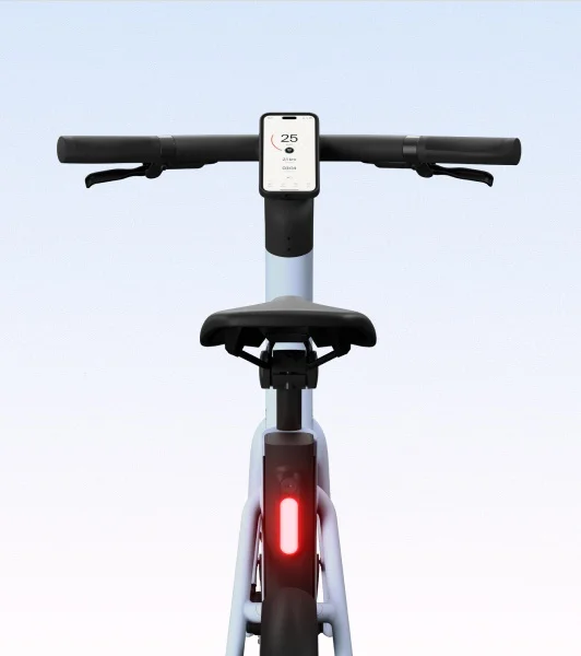 A close-up of the rear section of the Cowboy bike in Breeze, showcasing the seat, battery integration, and frame details.
