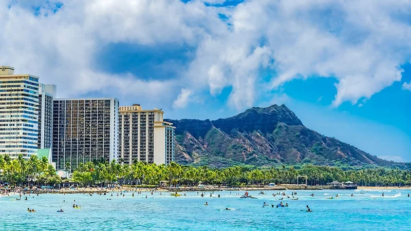 Image description: Waikiki Beach surfers in Honolulu, Hawaii.