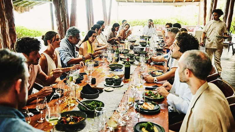 Image description: A large family dining together at a restaurant outside