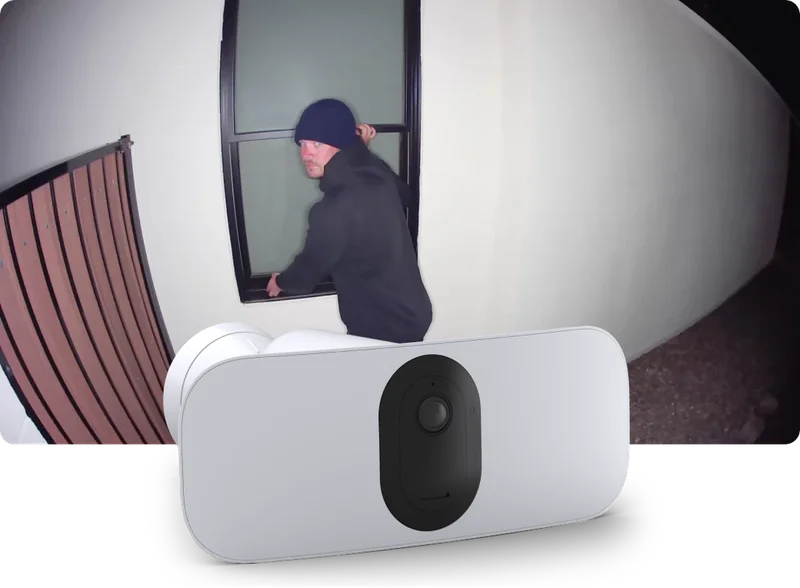 Pro 3 Wireless Floodlight Camera with a point-of-view image showing a burglar breaking into a home at night.