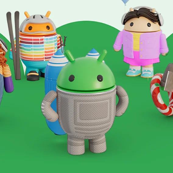 Three Android robots: one gray, one a skier, and one in pink with headphones, on a green landscape with a candy cane ring.