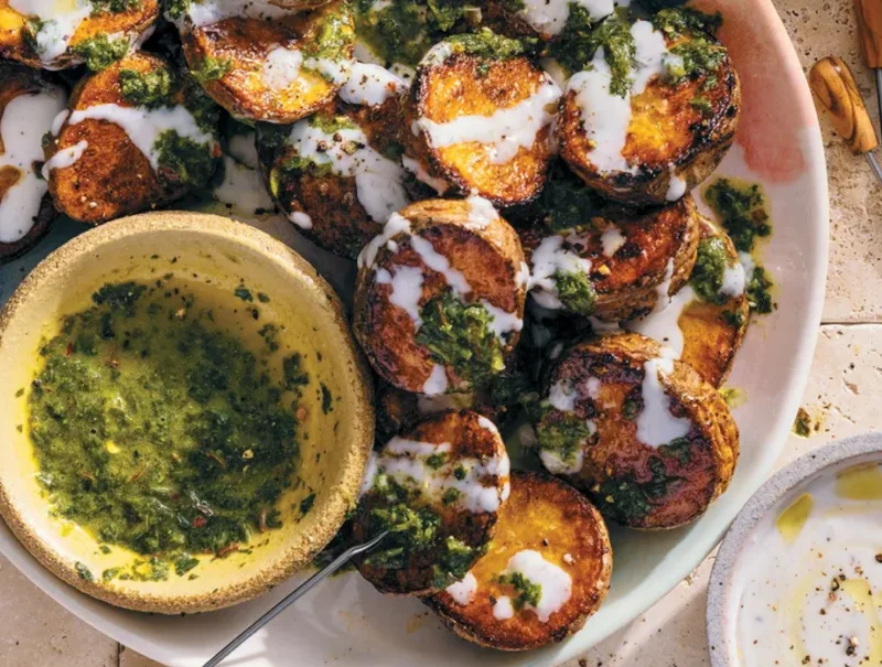 image of roasted potatoes with zhoug and zesty yogurt