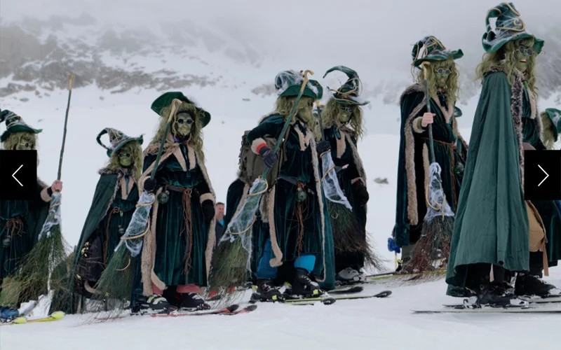 Skiers dressed in elaborate witch costumes participate in the Belalp Hexe festival in Switzerland's scenic Valais region.