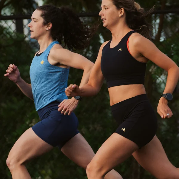 Two women running together