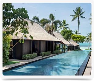 Serenity awaits in an oceanfront escape with swaying palms and a refreshing private pool.