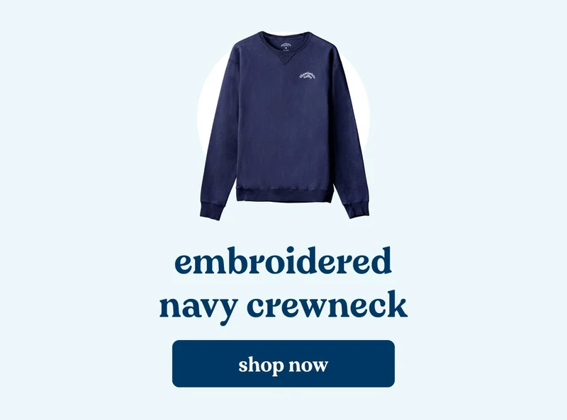 embroidered navy crewneck. shop now.