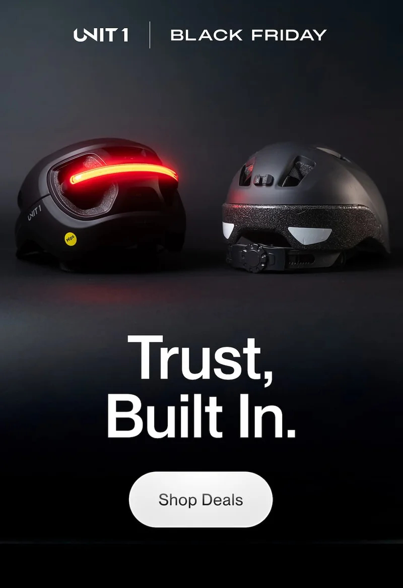 UNIT 1 Smart Helmet vs a regular helmet shown from the back with integrated rear lights glowing red for Black Friday.