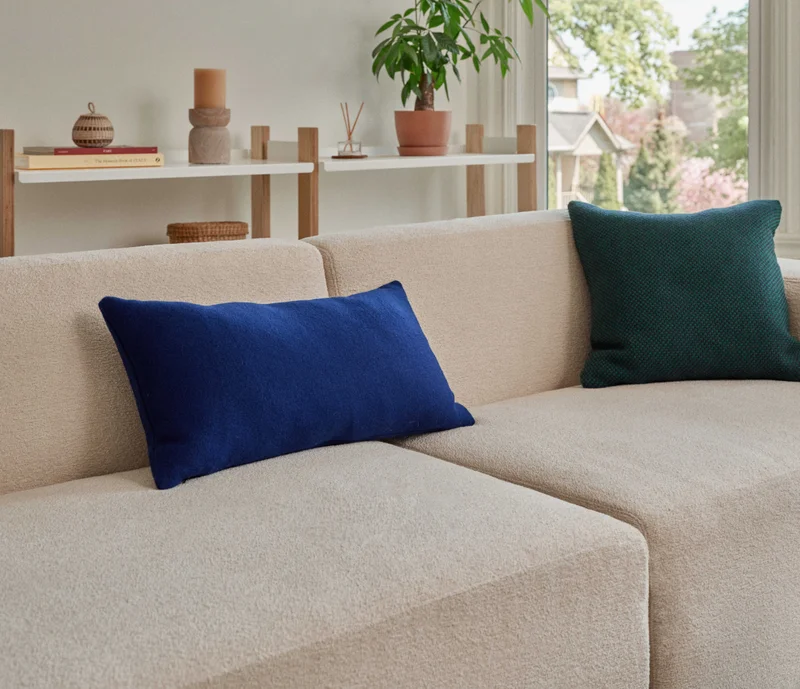 The Living Room Sale: Save 30%* on sectionals. Save 20%* sitewide. Pictured: The Form Sectional in Boucle & The Shelving System
