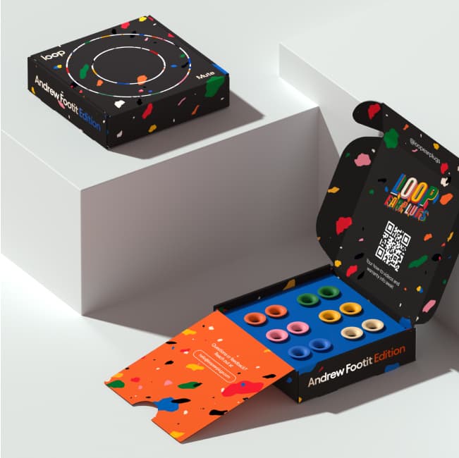 Colorful packaging for the Loop x Andrew Footit Experience earplugs and Loop Mutes.