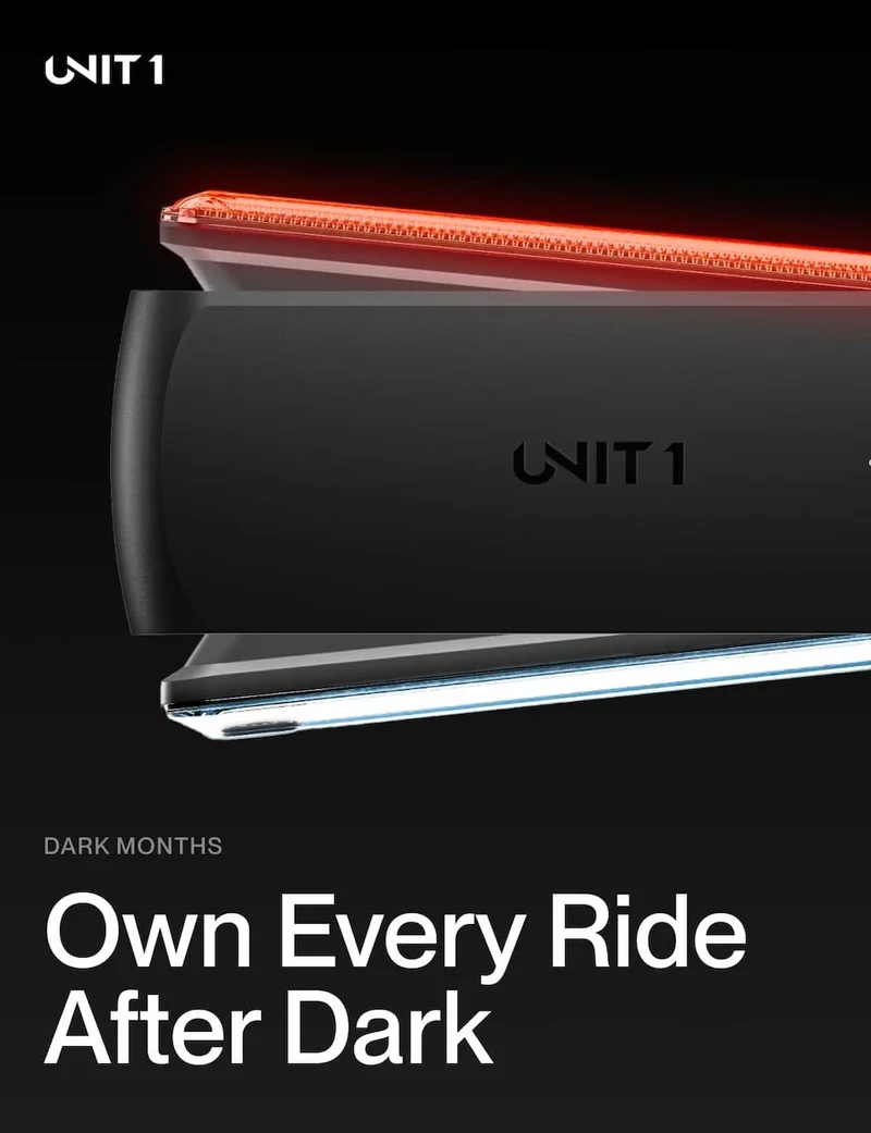 Close-up of UNIT 1 Smart Light Pro Dual with red rear beam for night visibility.
