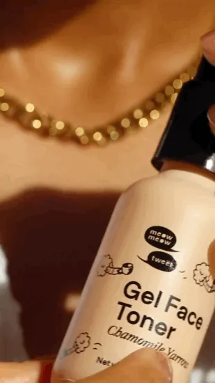 A Black person with tan skin applies a creamy shite gel toner to their face