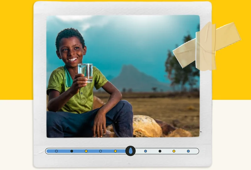 A polaroid of a young boy holding a clean glass of water. Below him, there is a horizontal progress tracker.