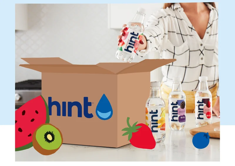 Boxes of Hint stacked by a door