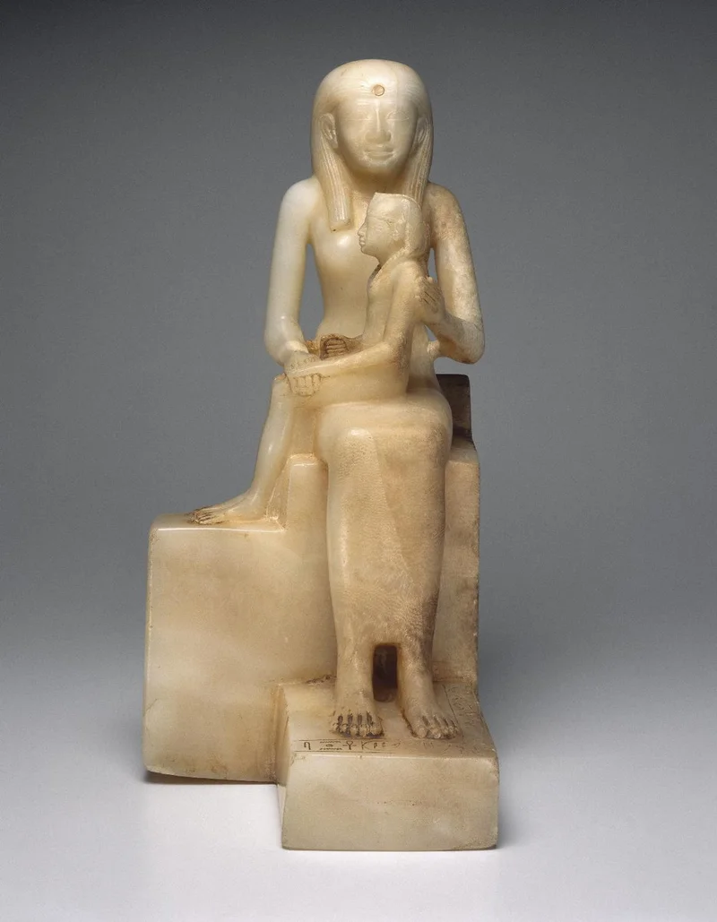 Alabaster sculpture of a seated female figure with a child on her lap