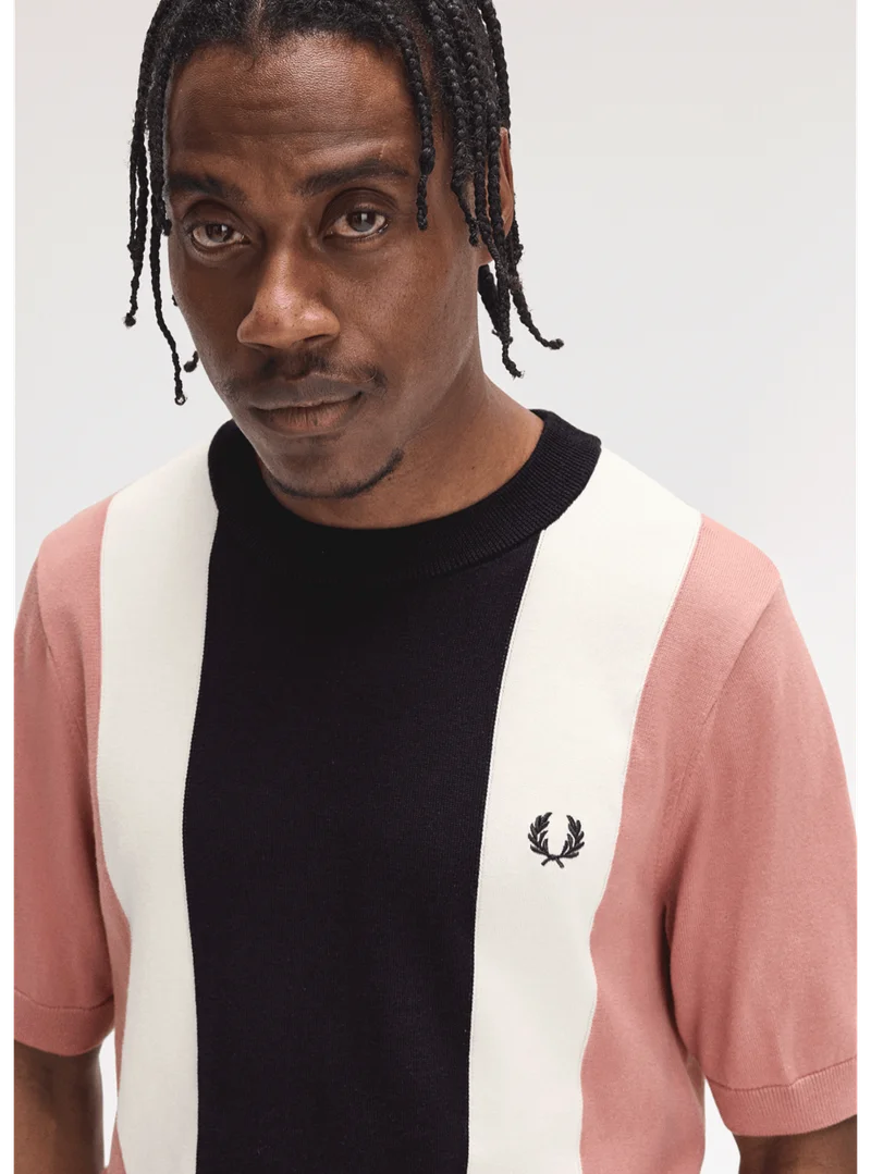 Fred Perry New Releases: model wears a Fred Perry Vertical Stripe Knitted T-Shirt in Putty Pink
