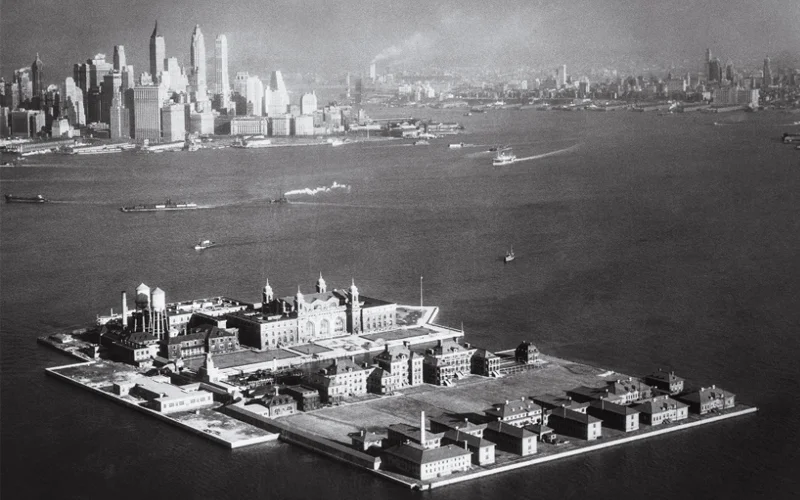 Black and white photo of an aerial view of Ellis Island.