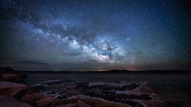 Image description: Night sky with view of milky way at Canyonlands National Park, Utah
