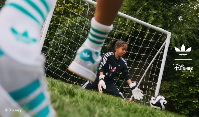 Young girl in a goalie net saving the ball.
