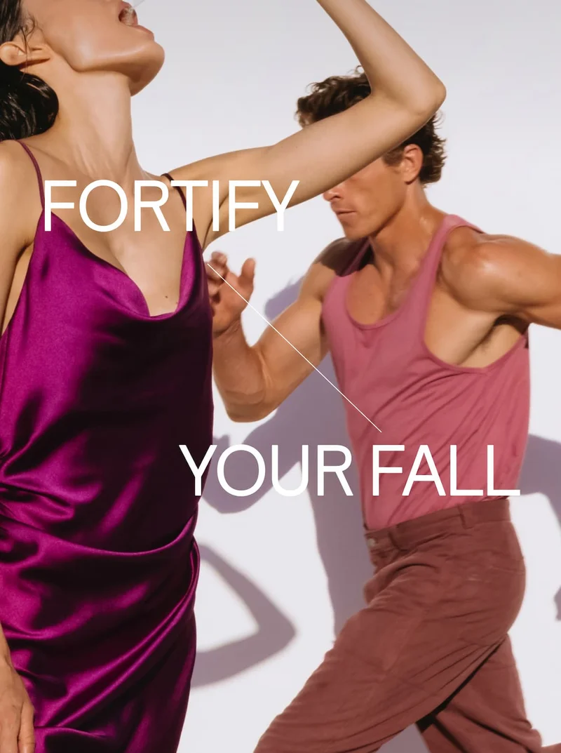 Two people in motion wearing shades of pink and purple with text ‘Fortify Your Fall.’ Promotes ARMRA’s immune support for the fall season.