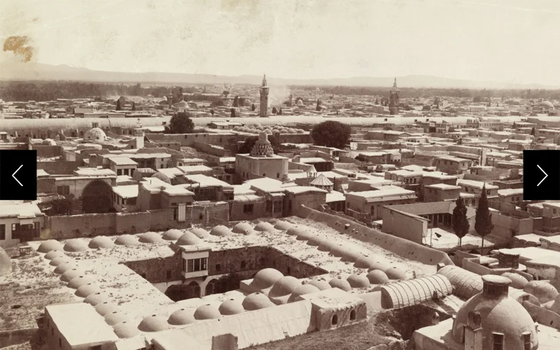 A rooftop view of domes, minarets, and two story caravansaries in Damascus, Syria in 1911.
