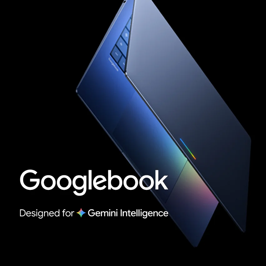 Dark blue laptop with iridescent accents and text reading 'Googlebook: Designed for Gemini Intelligence' with a colorful star icon.