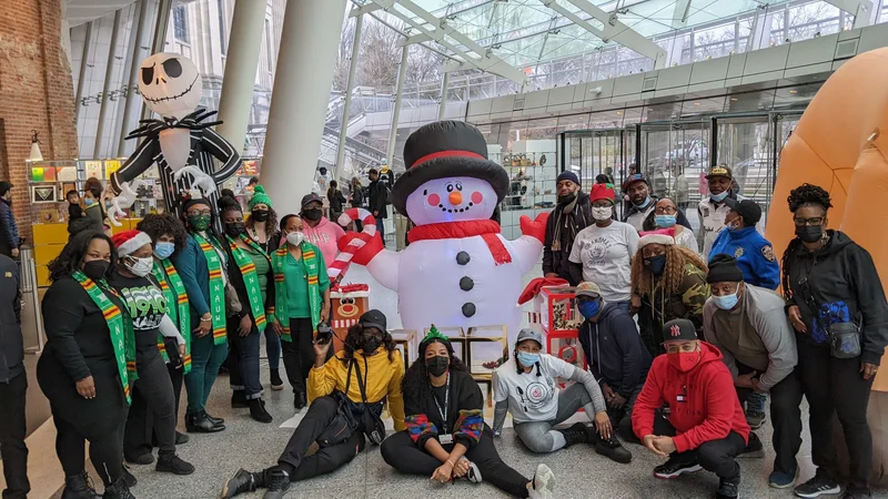 People gathered around an inflatable snowman