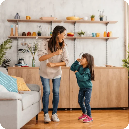 a mom and daughter dancing playing a quick game a mom and daughter dancing playing a quick game