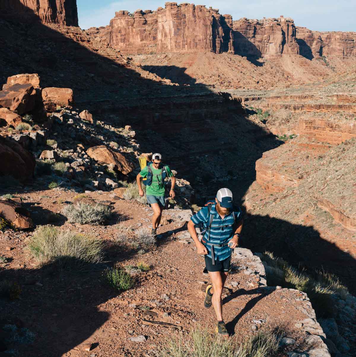 Two trail runners in the desert.
