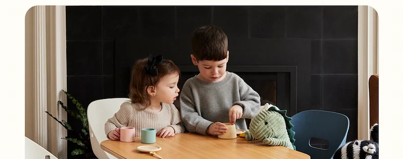 Siblings playing at the Play Kit